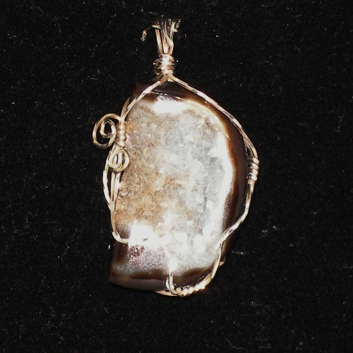 Pendant with a natural stone design on a black background