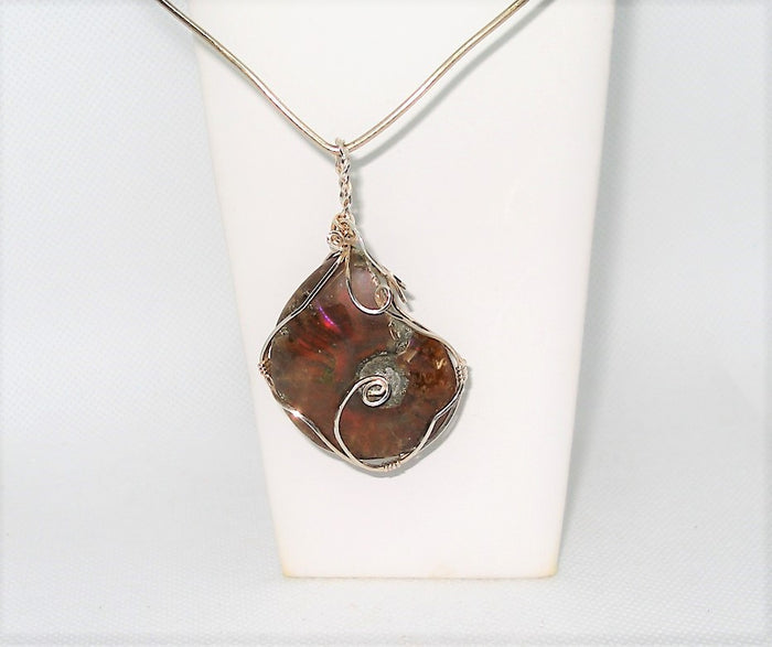 Necklace with a unique ammonite pendant on a white background