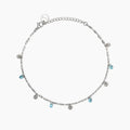 Cavigliera con charms martellati e glass azzurri