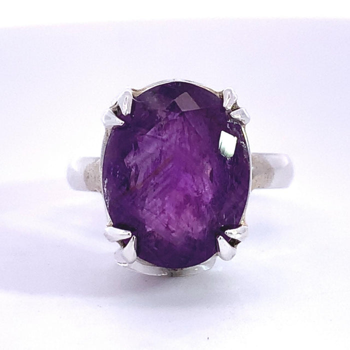 photo of an oval amethyst silver ring on a white background
