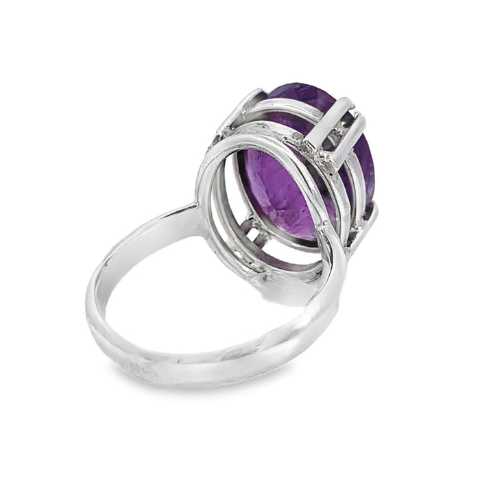 photo of an oval amethyst silver ring on a white background rear view