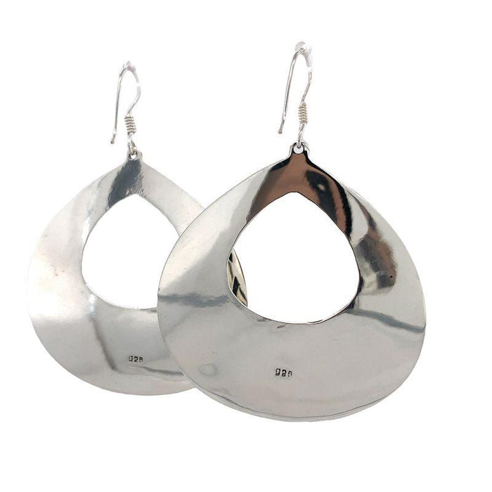 Photo of a pair of silver earrings  on a white back ground back view