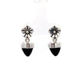 a sterling silver dangle earring with a bezel set black onyx bullet with a floral top on a white background front view