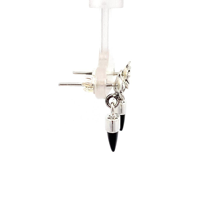 a sterling silver dangle earring with a bezel set black onyx bullet with a floral top on a white background side view