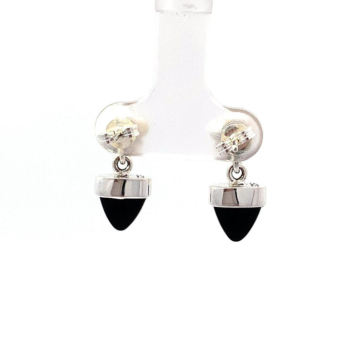 a sterling silver dangle earring with a bezel set black onyx bullet with a floral top on a white background backview
