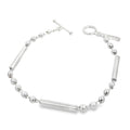 photo of a silver link bracelet made of bars and ball on a white background
