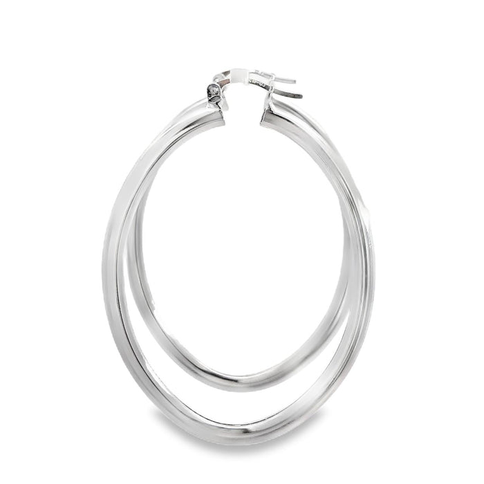 photo of a pair of oval silver hoop earrings on a white back ground