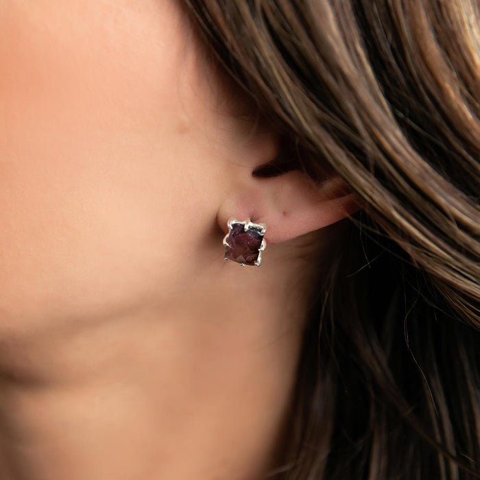 photo of a brunette model wearing a  silver amethyst earring