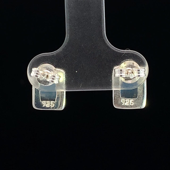 photo of a rectangular silver white moonstone stud earring on a black background rear view