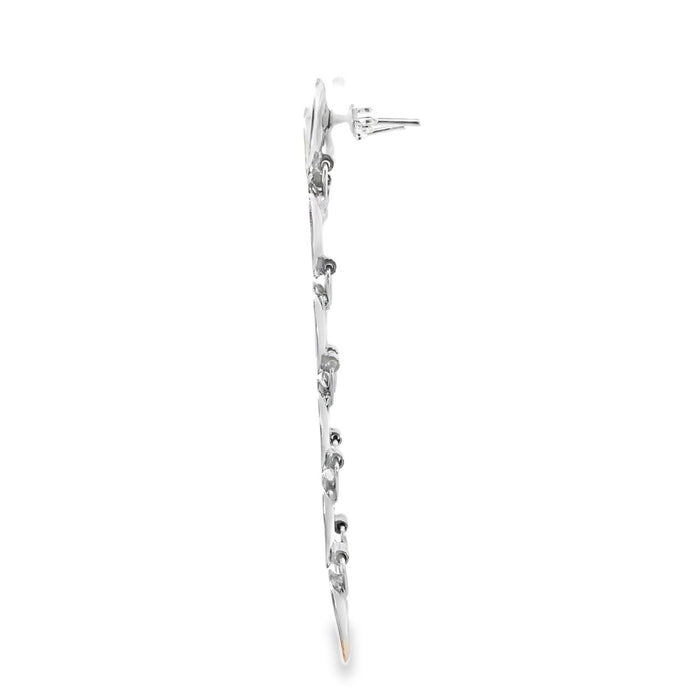 photo of  silver long six oval disk earring on a white background  side view