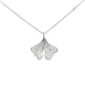 photo of a silver ginkgo leaf pendant on a chain taken on a white background