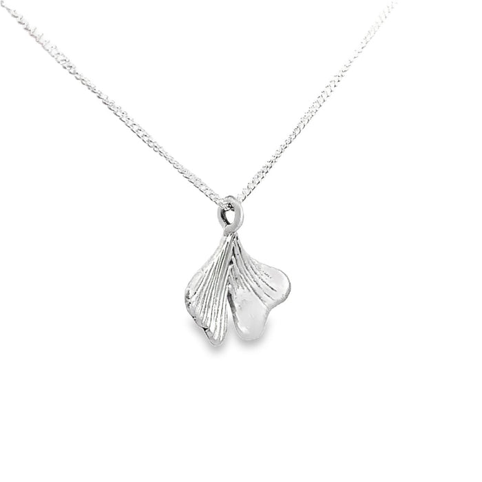 photo of a silver ginkgo leaf pendant on a chain taken on a white background