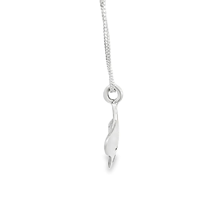 photo of a silver ginkgo leaf pendant on a chain taken on a white background side view