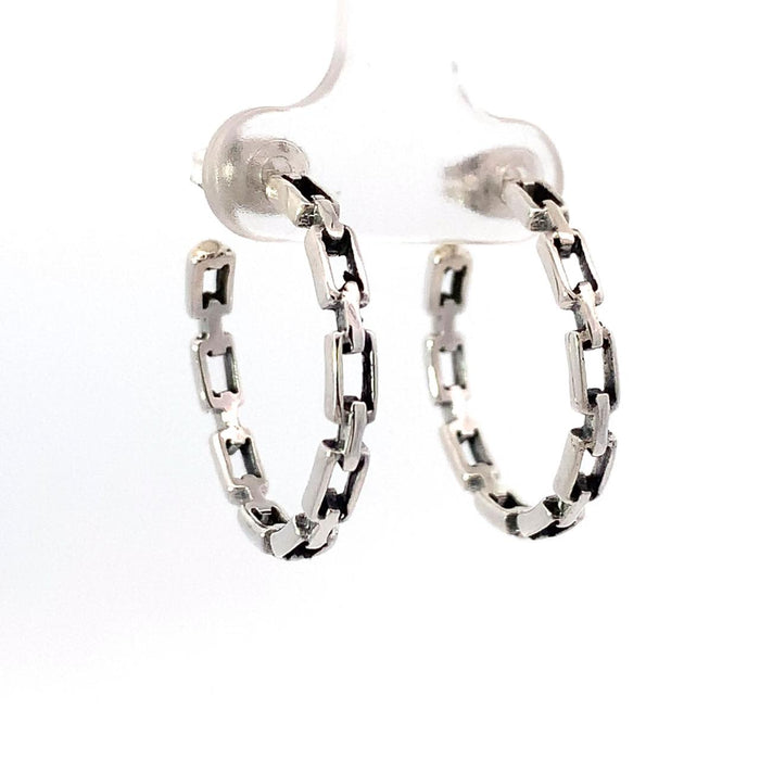 photo of a a silver chain design hoop earring on a white background