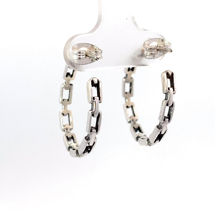 photo of a a silver chain design hoop earring on a white background