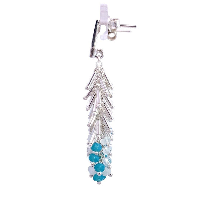 photo of a silver fringe styled earring with blue and white beads on a white background side view