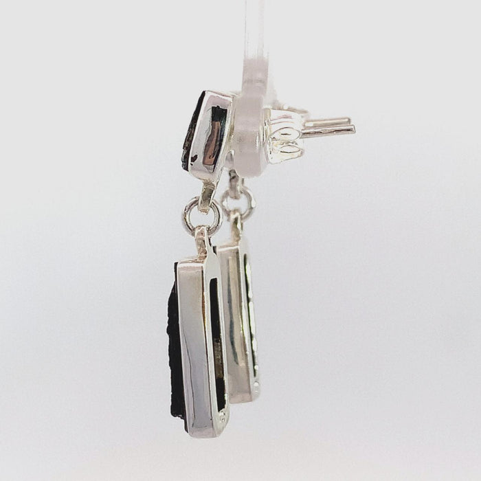 photo of a two gem raw black tourmaline dangle earring on a white background side view