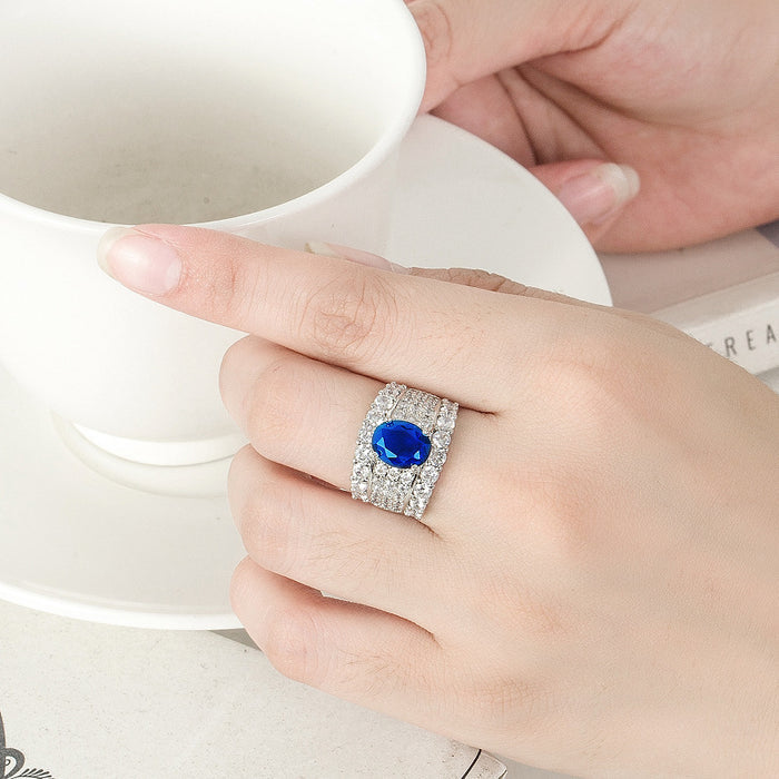 Bold, regal, and breathtaking, the Blue Majesty Crown Ring captures the very essence of royal luxury. Its deep sapphire-blue artificial gemstone sits at the center like a crowned jewel, surrounded by rows of shimmering crystals that reflect light from every angle. Crafted from premium copper, this adjustable ring wraps your finger in comfort while delivering an unmistakable presence.