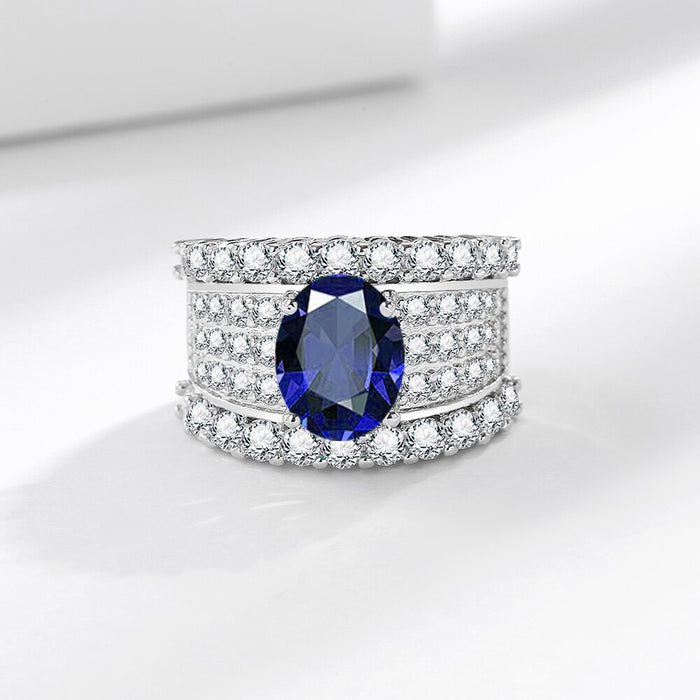 Bold, regal, and breathtaking, the Blue Majesty Crown Ring captures the very essence of royal luxury. Its deep sapphire-blue artificial gemstone sits at the center like a crowned jewel, surrounded by rows of shimmering crystals that reflect light from every angle. Crafted from premium copper, this adjustable ring wraps your finger in comfort while delivering an unmistakable presence.
