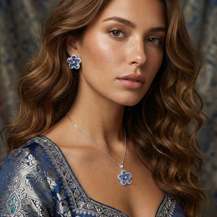 The&nbsp;Bluebell Icelia Set is a graceful 3-piece floral collection featuring a 5-petal pendant and matching earrings. Each petal is crafted with pastel blue stones in a teardrop shape, surrounding a silver zircon center. The outer rim of each flower is finished with fine-cut zircon stones for an icy brilliance that catches the light, and everyone’s eye.