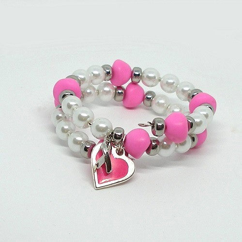 Bracelet with pink and white beads and a heart charm on a light gray background