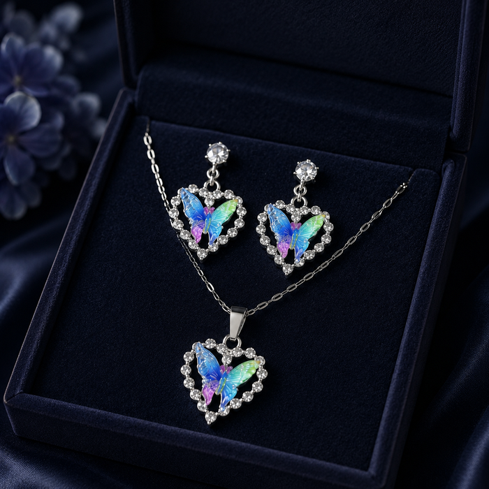 A symbol of love wrapped in delicate butterfly wings, this jewelry set captures the magic of transformation and the warmth of the heart. Featuring vibrant iridescent butterflies nestled inside sparkling heart-shaped frames, it creates a dreamy statement that feels romantic, whimsical, and effortlessly enchanting.