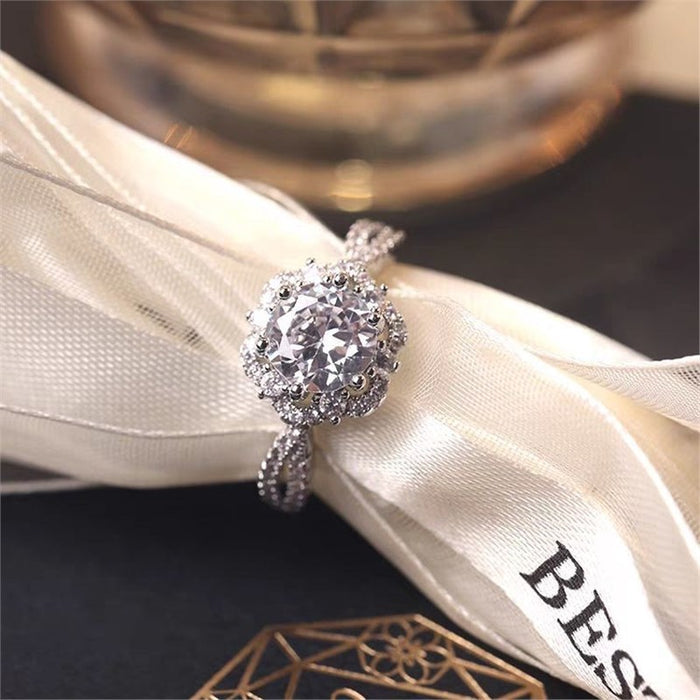 A radiant duo designed to symbolize love and commitment Celestial Promise Ring capture the sparkle of timeless romance. The brilliant center stone surrounded by delicate crystal accents creates a graceful design that feels both elegant and meaningful.