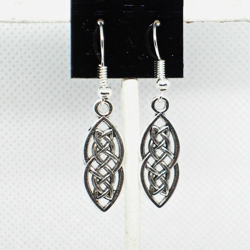 Silver celtic knot earrings on a black card with a white background