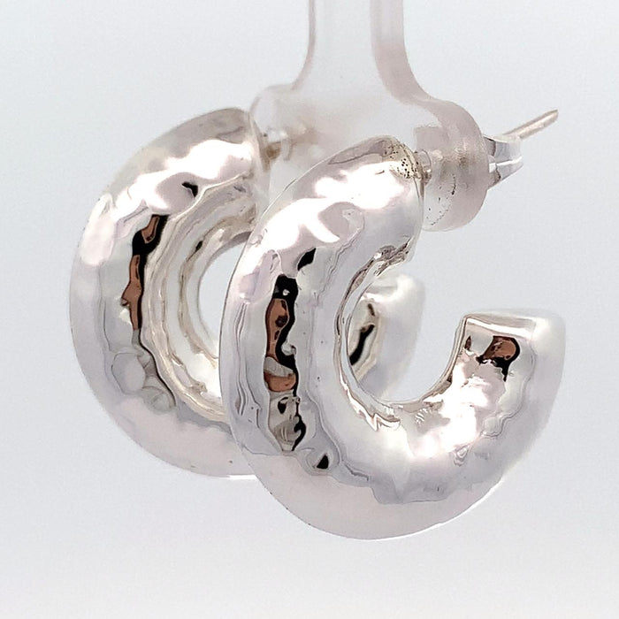 photo of chunky silver hoop earrings on a white background side view