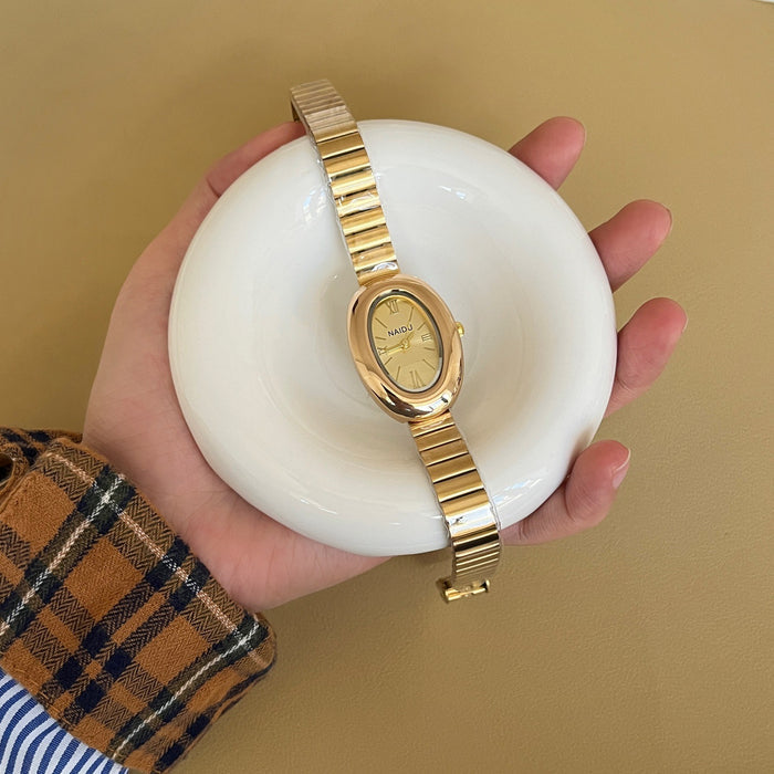 A refined oval dial wrapped in a smooth golden frame, designed to move effortlessly with your everyday moments. Minimal yet expressive, this watch brings quiet luxury to every wrist — perfect for daily wear or thoughtful gifting.