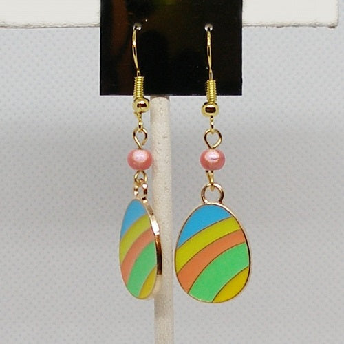 Colorful striped easter egg earrings with pink beads on a gray background
