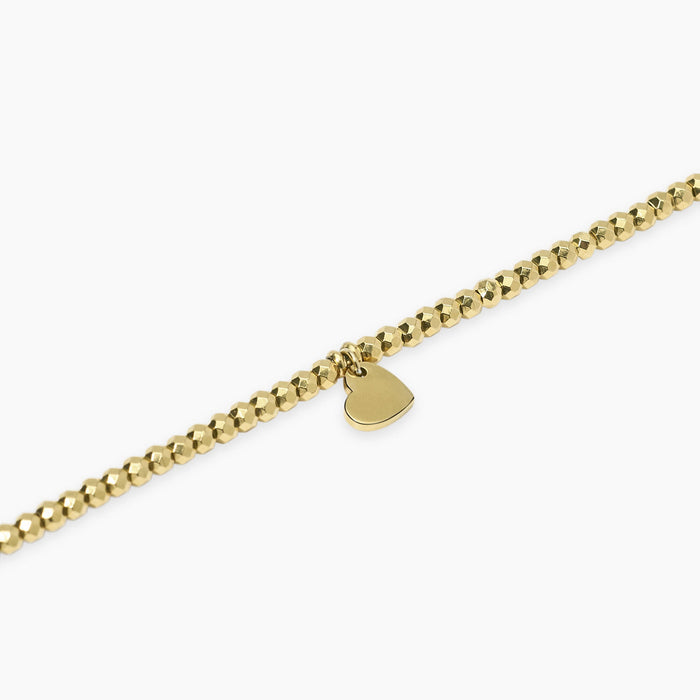 Bracciale dorato con sfere e ciondolo cuore