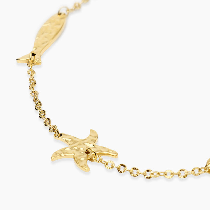 Bracciale dorato con elementi marini