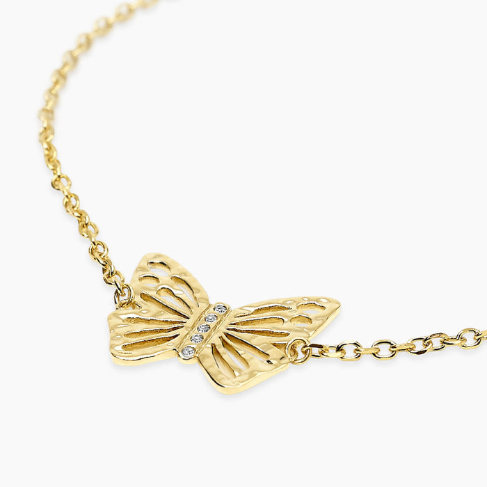 Bracciale dorato con farfalla