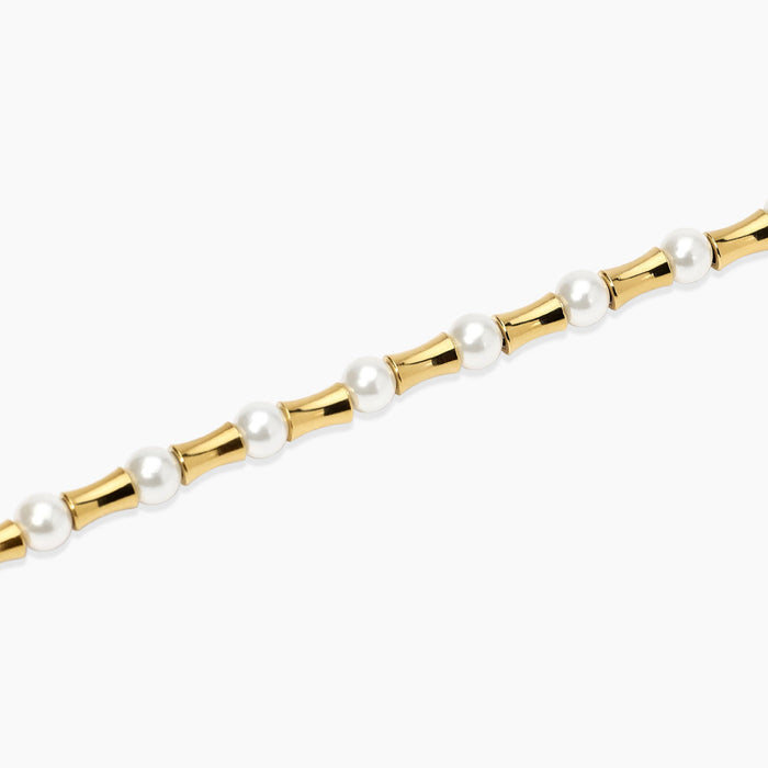 Bracciale dorato con elementi bambù e perle