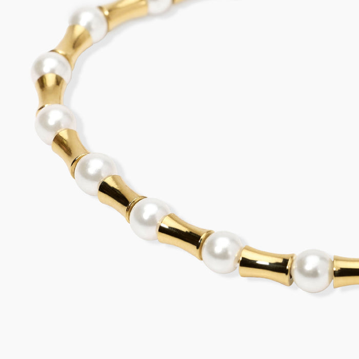 Bracciale dorato con elementi bambù e perle