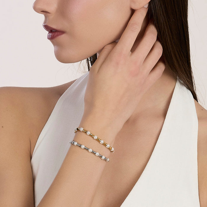 Bracciale dorato con elementi bambù e perle