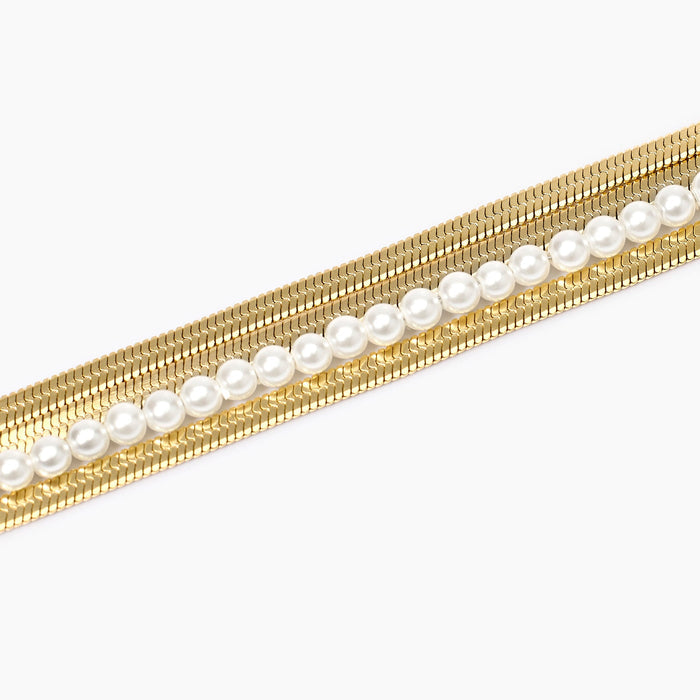 Bracciale catene e perle conchiglia in acciaio dorato