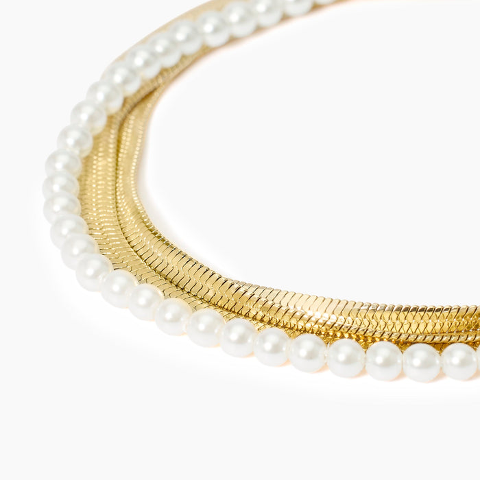 Bracciale catene e perle conchiglia in acciaio dorato
