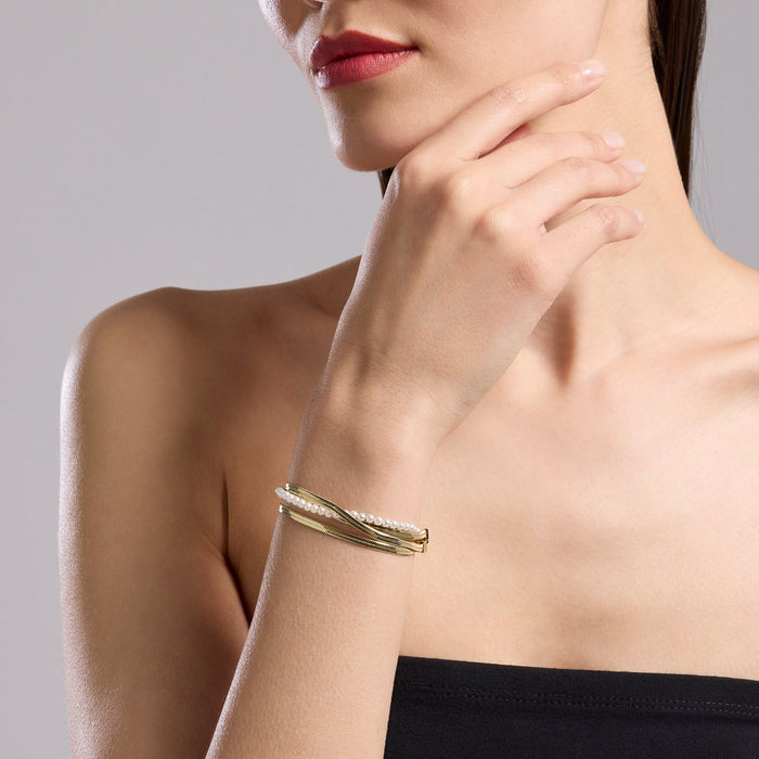 Bracciale catene e perle conchiglia in acciaio dorato