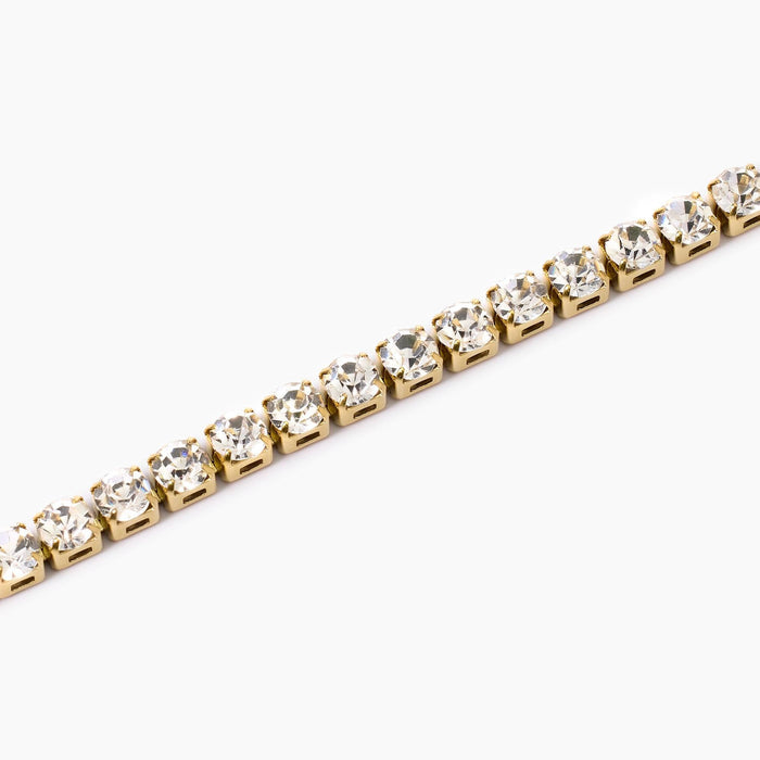 Bracciale tennis dorato con cristalli bianchi