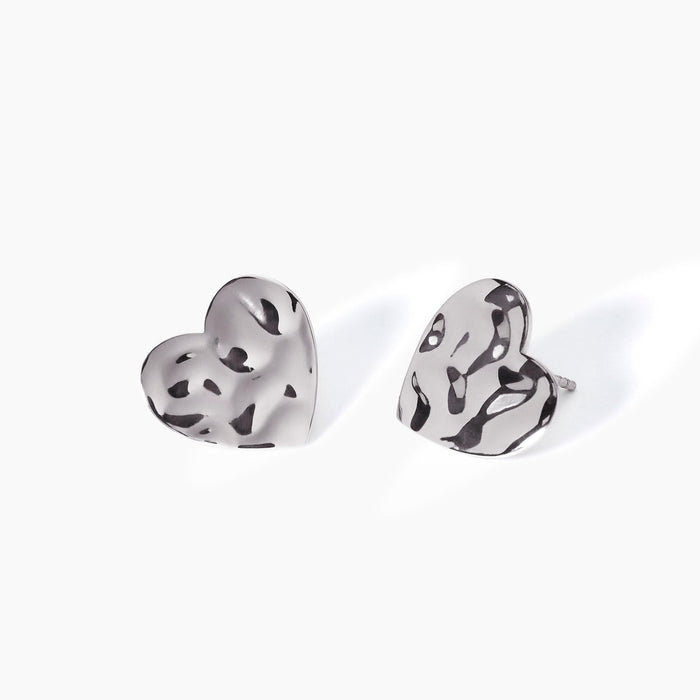 Orecchini cuore effetto martellato