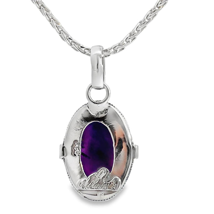 photo of a silver oval amethyst cabochon pendant on a silver chain on a white background rear view
