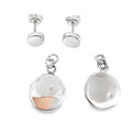 photo of a silver two part disk earring on a white background