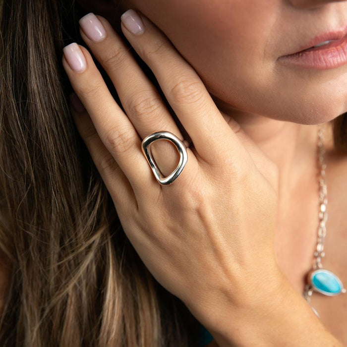 brunette model wearing a modern silver ring