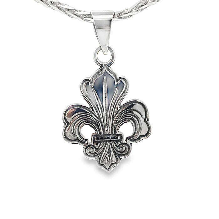 photo of a silver fleur de lis pendant and chain on a white background