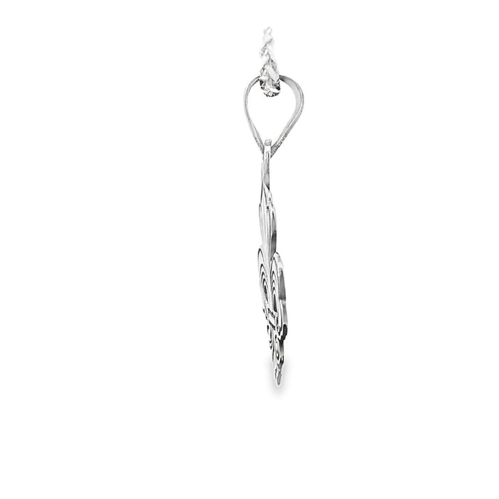 photo of a silver fleur de lis pendant and chain on a white background side view