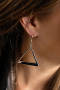 Photo of a brunette model wearing an earring