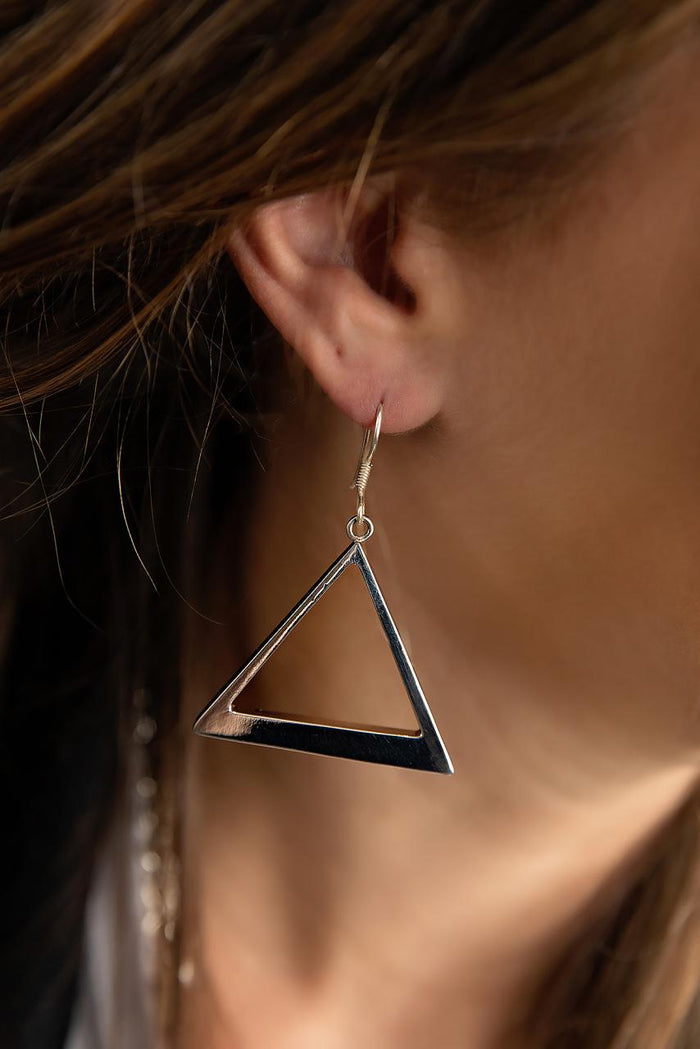 Photo of a brunette model wearing an earring