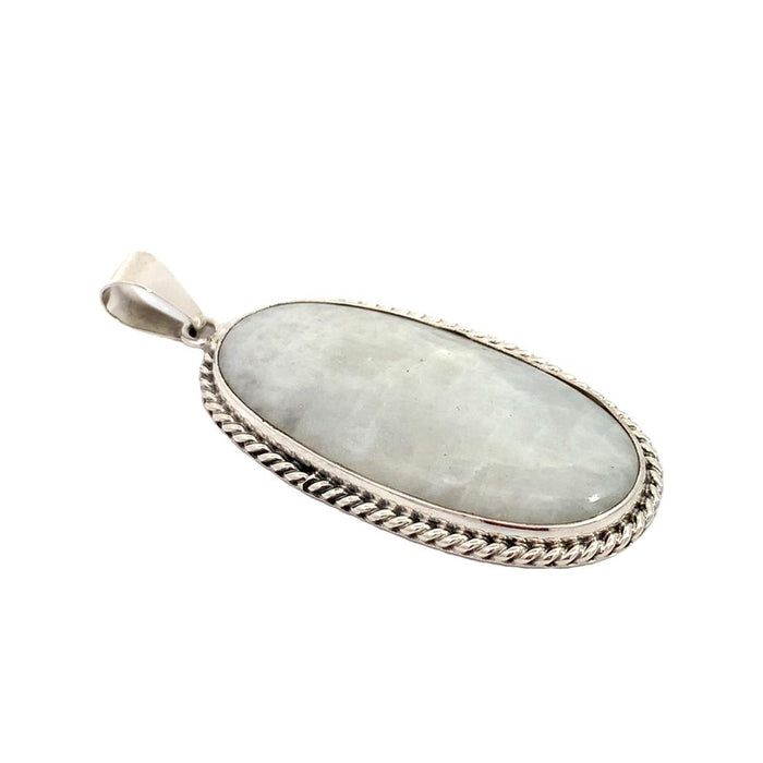 photo of a long oval silver white moonstone pendant on a white background